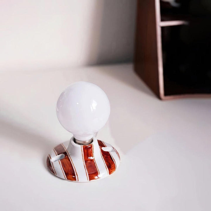 Wall Light Sconce With Striped Spherical Illumination